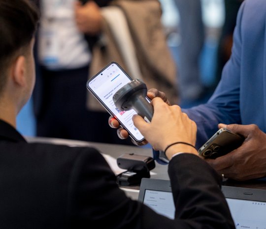 Technology Rental barcode scanner scanning a mobile barcode for attendee check-in and event registration