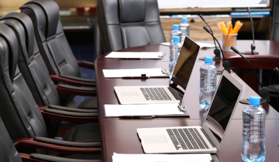 Professional conference setup with Apple MacBook Pro laptops
